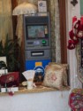 An ATM nestled in a shop window